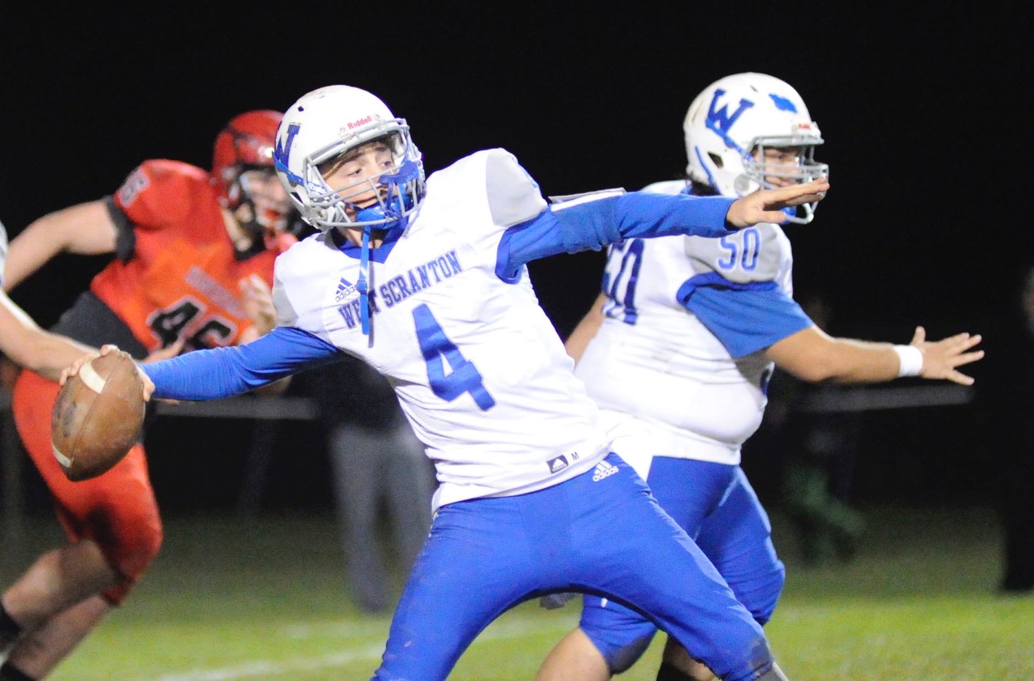 Going for broke. West Scranton’s QB Dan Van Dusky tries a “Hail Mary” late in the game. In a last-minute drive, the Invaders almost scored deep in Hornets territory, but failed to put points on the board...